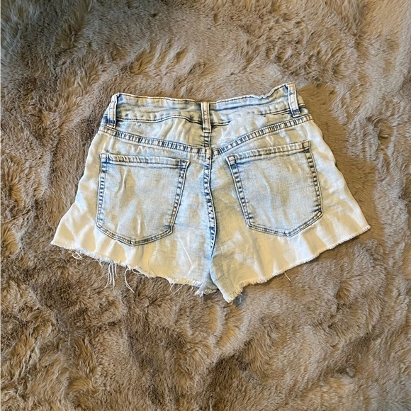 Blue shorts with slight ripped ends for  a distressed look. - Picture 2 of 2